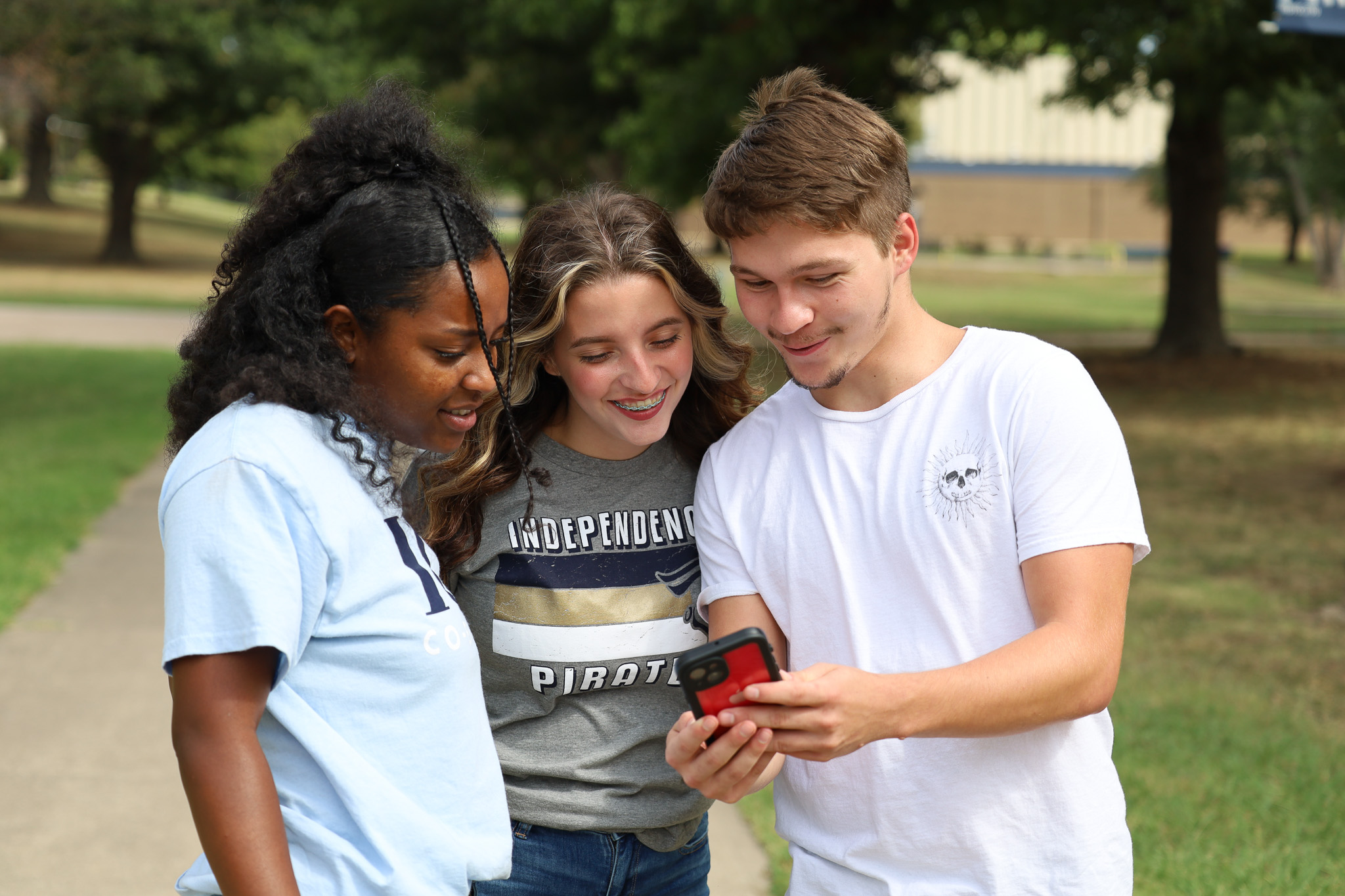 students looking at phone