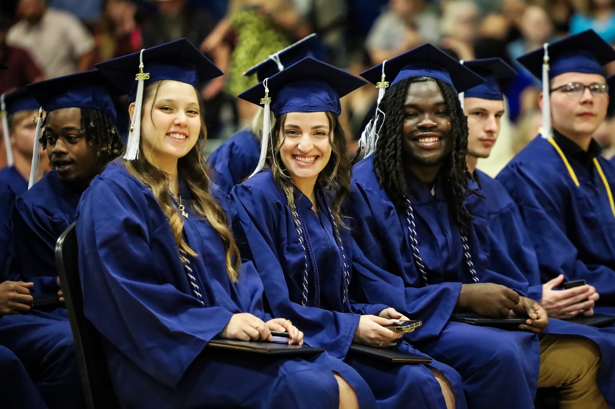 graduates smiling