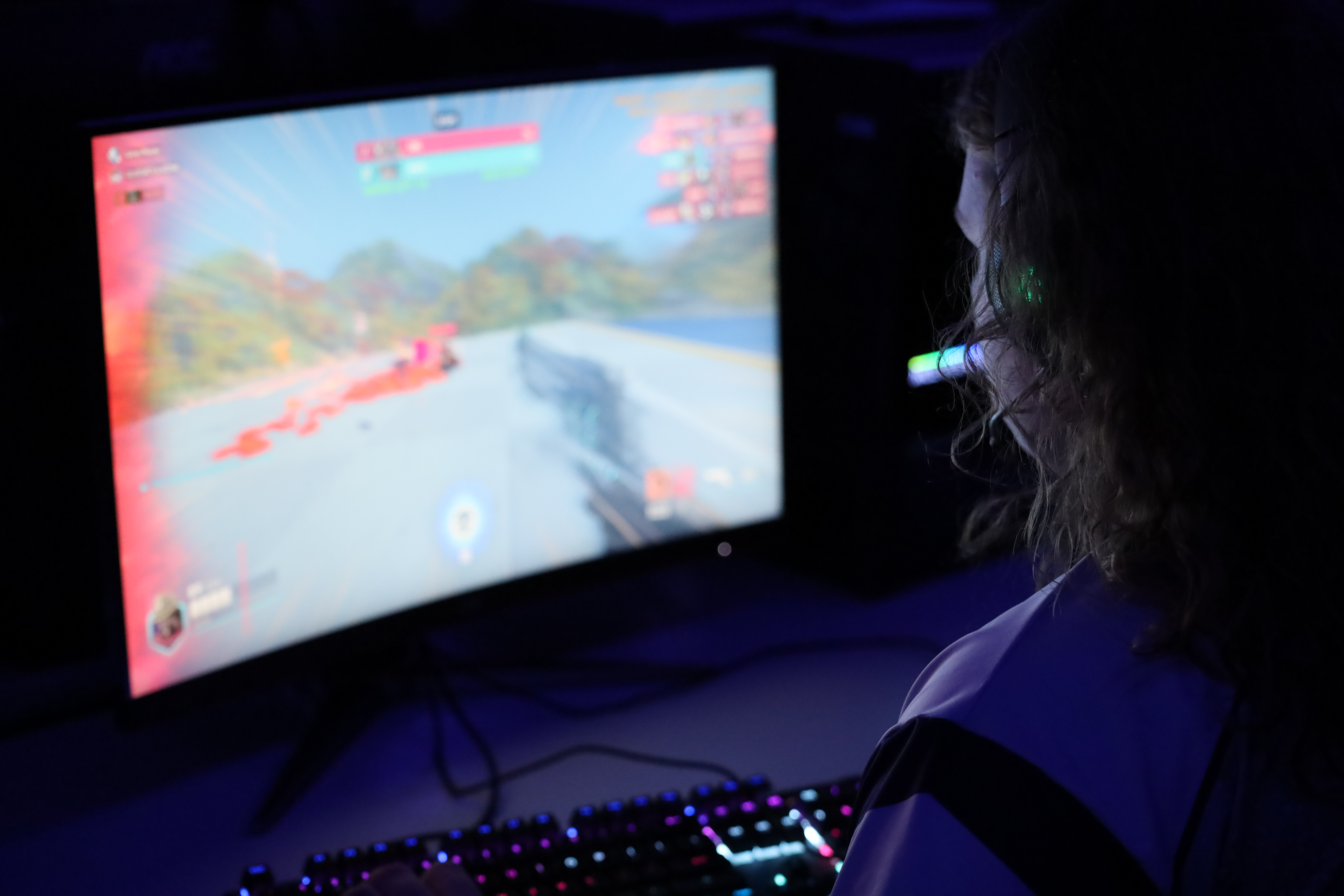 esports gamer playing game on pc
